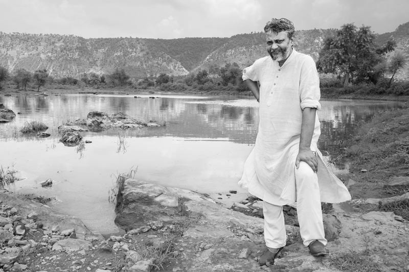Rajendra Singh - The Water Man of India, standing in front of Chountrawala Johad - the first johad in village Gopalpura, district Alwar, Rajasthan, where he started water conservation work in 1985